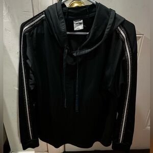 A light black hoodie. Size 1X. Has glitter strips on both arms. Pro player brand